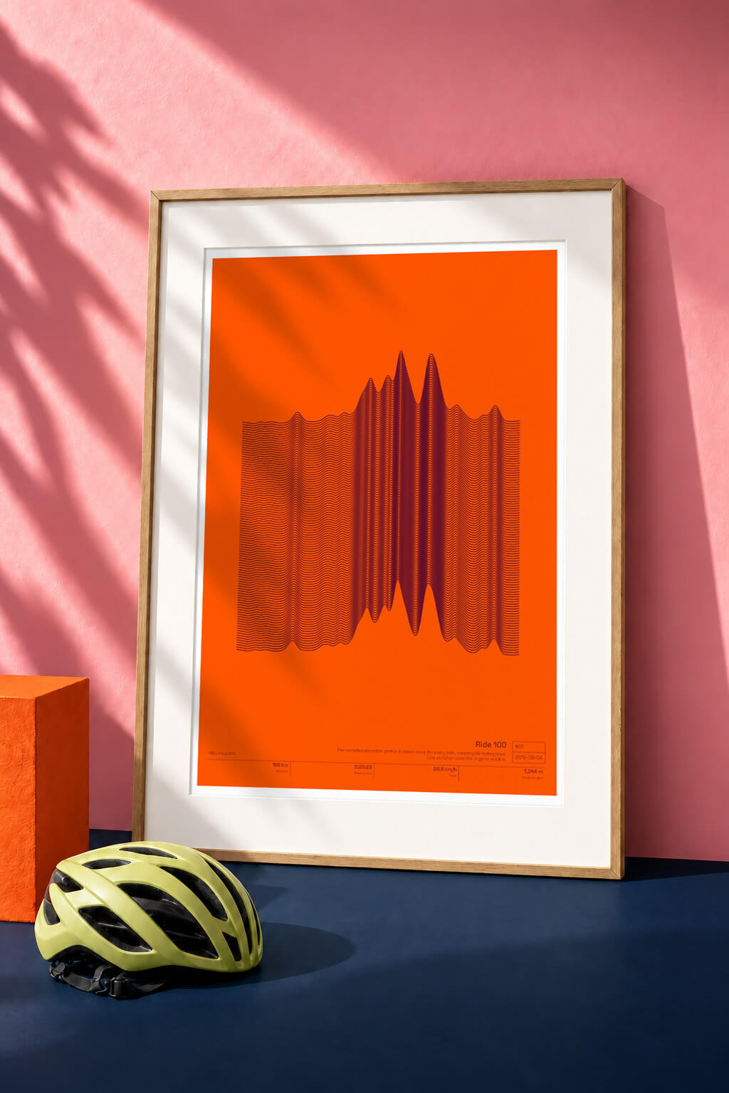 Orange activity artwork framed in a pink room