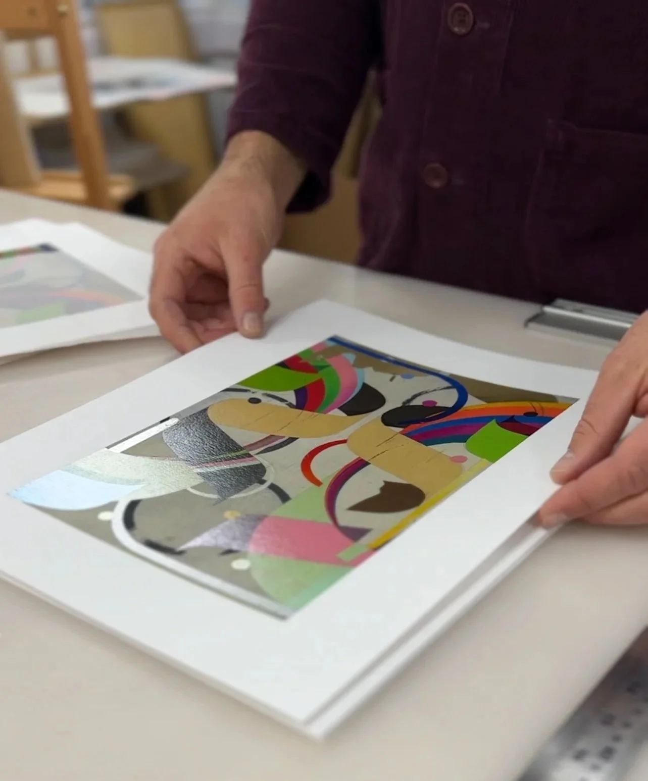 Bicep Press printmakers checking a fine-art print together at the studio table